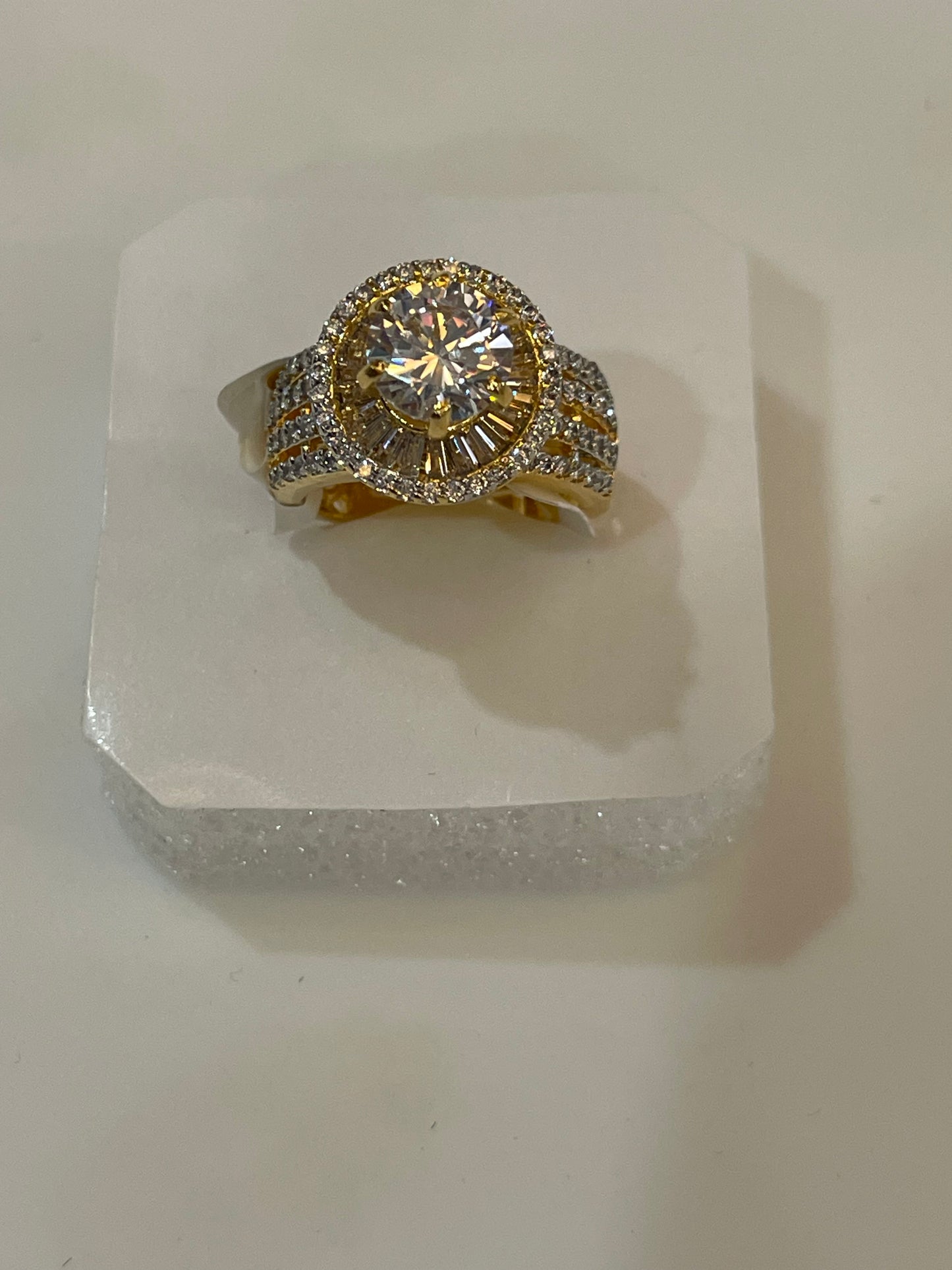 Golden ring with diamond accents.