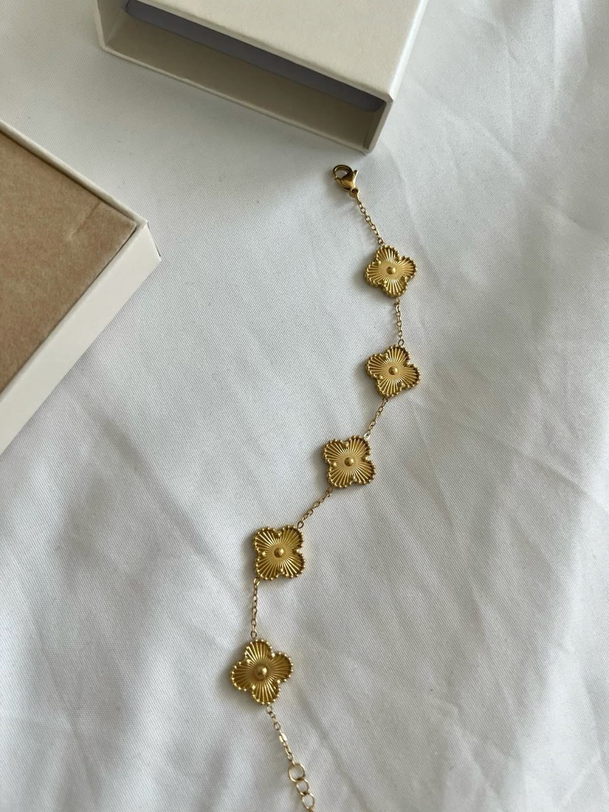 Golden Clove-shaped bracelet made of high quality material with anti-tarnish finish, elegant jewelry for women
