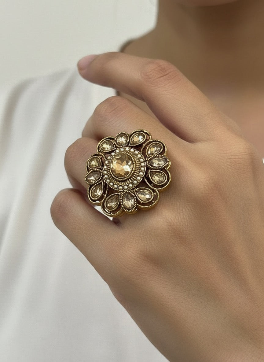 Golden cocktail ring with intricate design