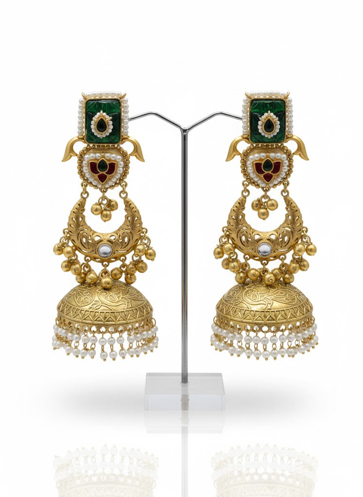 Gold toned earrings with green and red gemstones and tiny white pearls