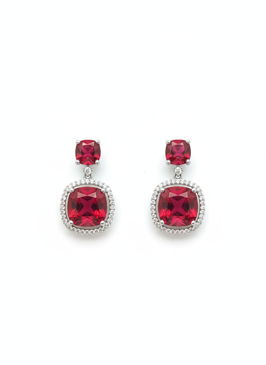 Pair of earrings with red gemstones