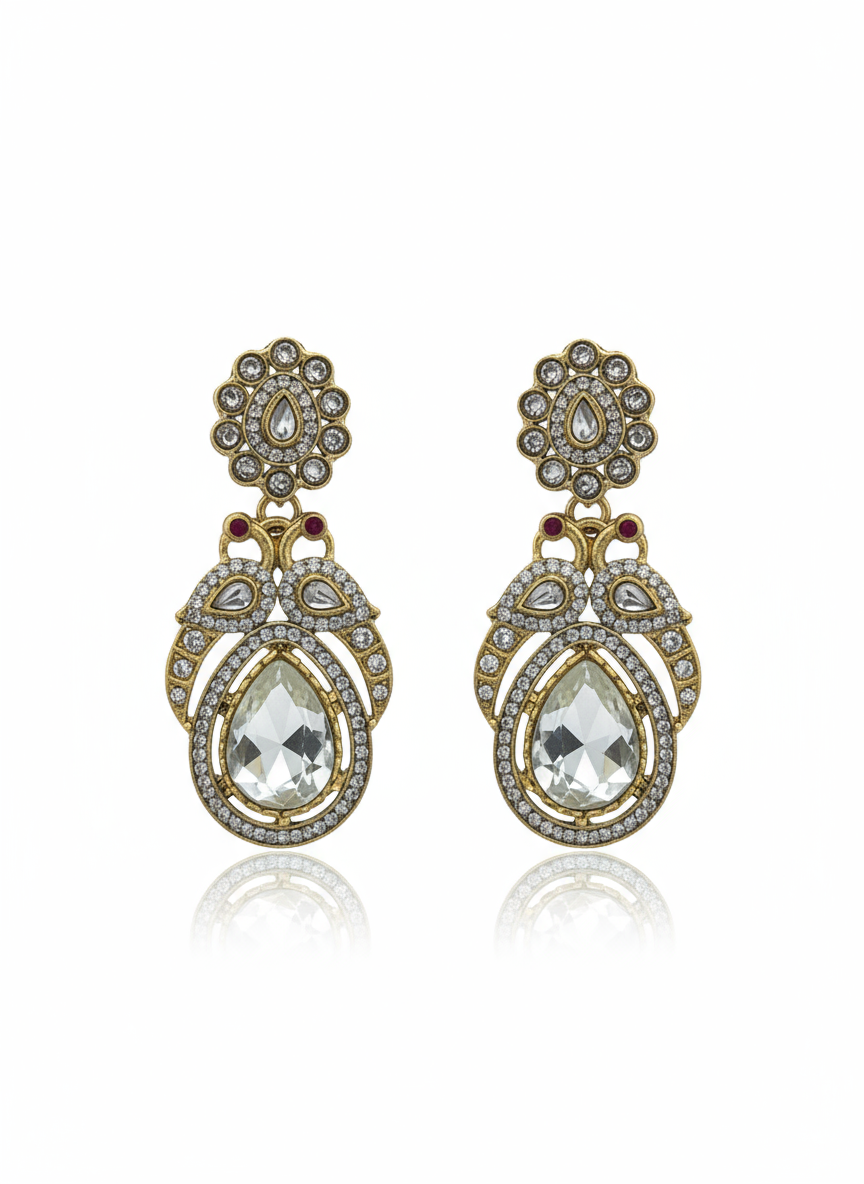 Ornate earrings with clear teardrop stones and gold toned accents