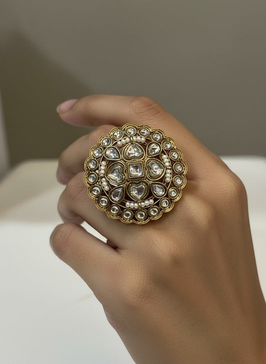 Cocktail ring golden plated with round pear shaped and heart shaped gemstones