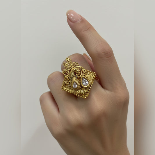 Golden ring with intricate design.