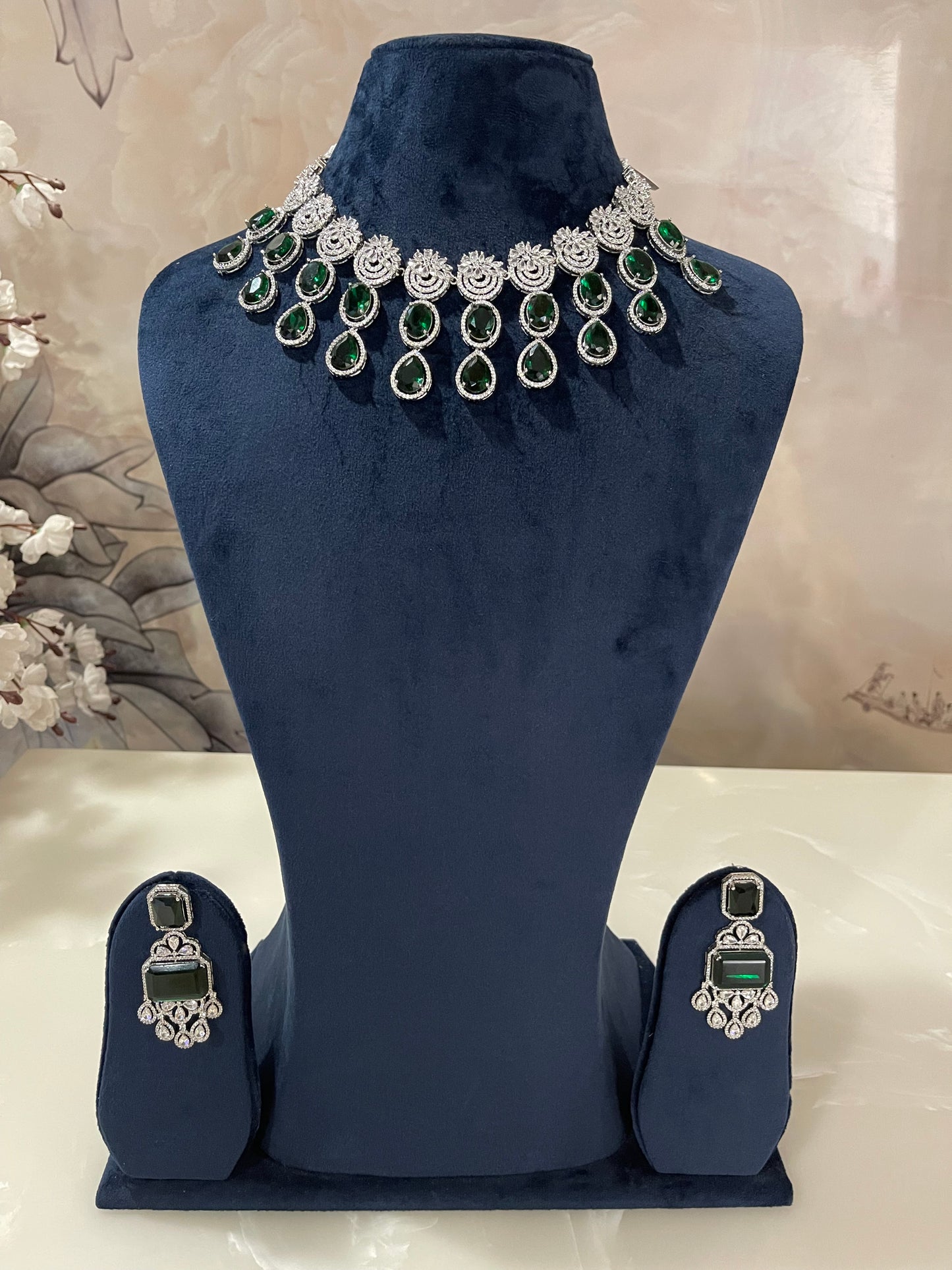 Decorative green and silver gemstone embellishments.
