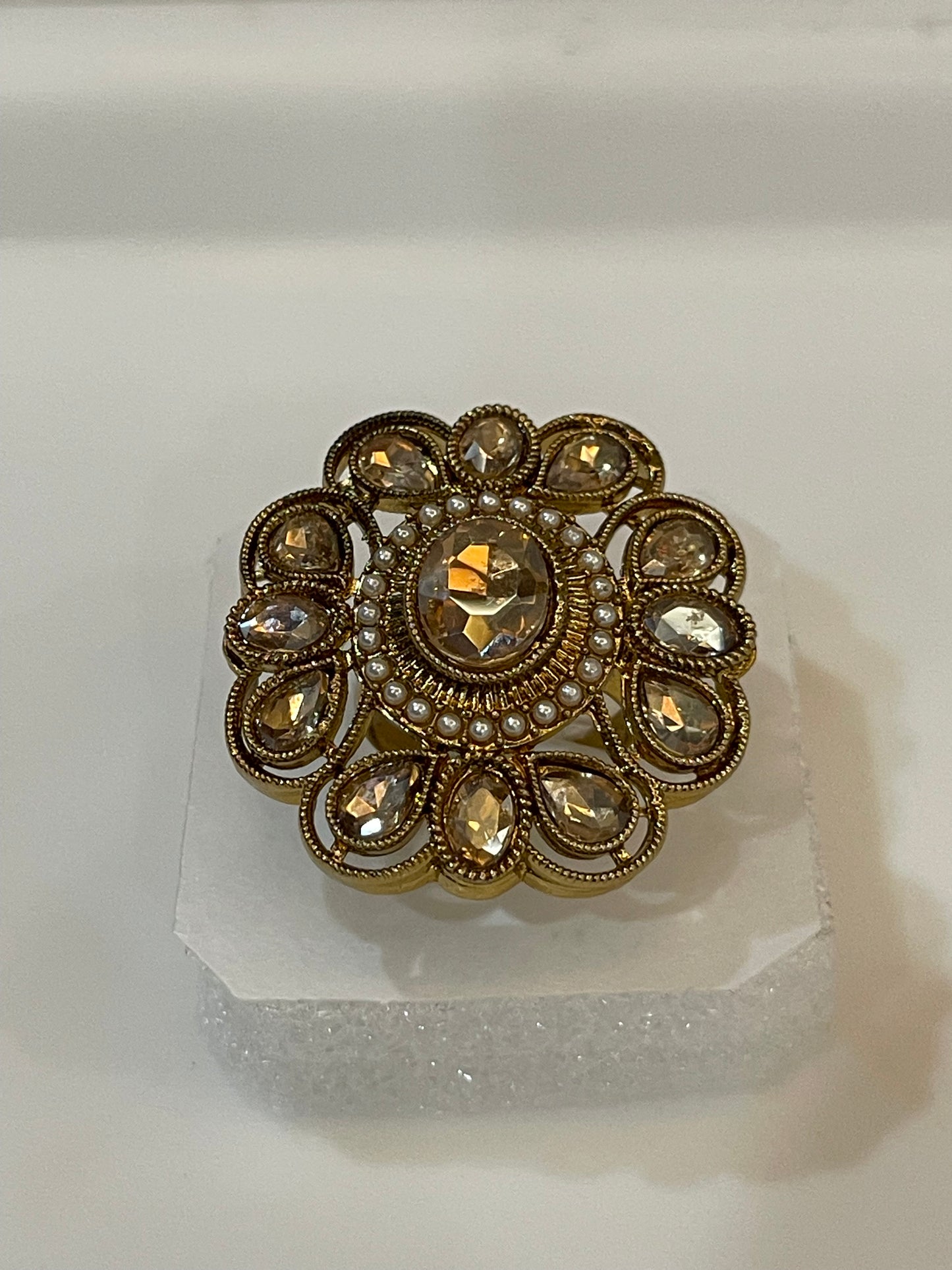 Decorative brooch with gemstones and pearls golden plated