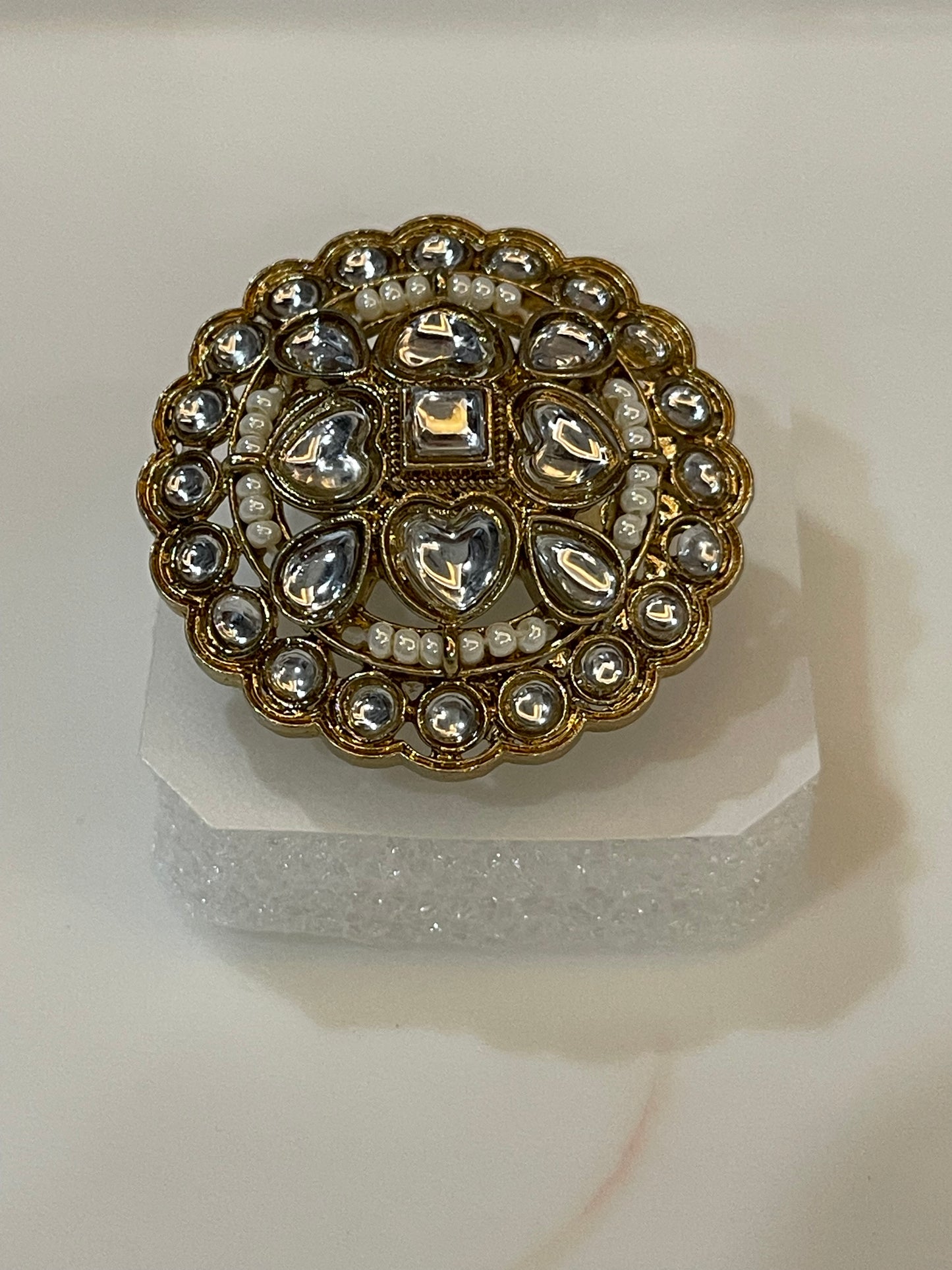 Cocktail ring golden plated with round pear shaped and heart shaped gemstones