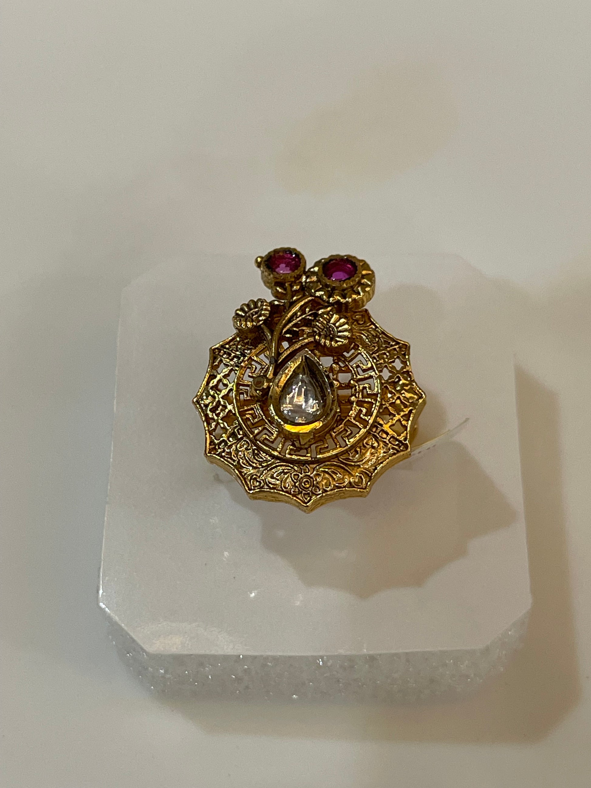 Golden ring with pink and white gemstones petal shaped