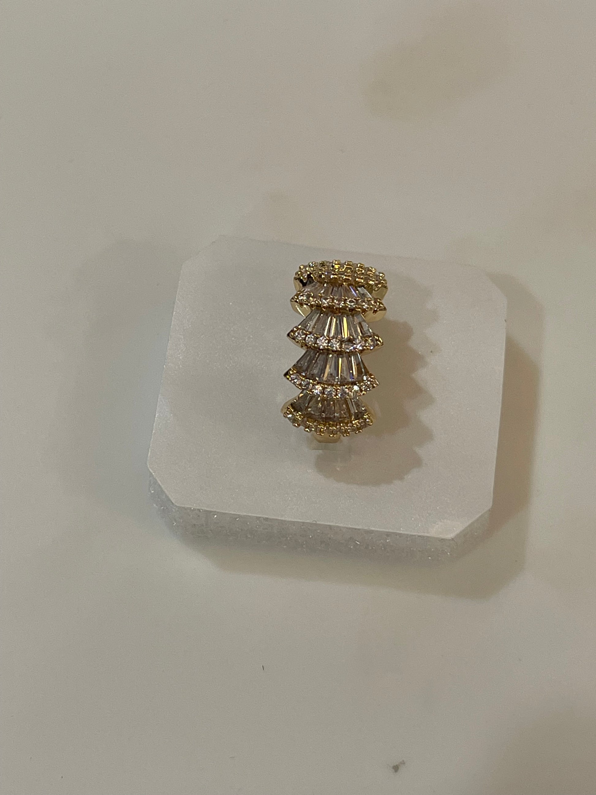 Golden ring with clear stones accents 