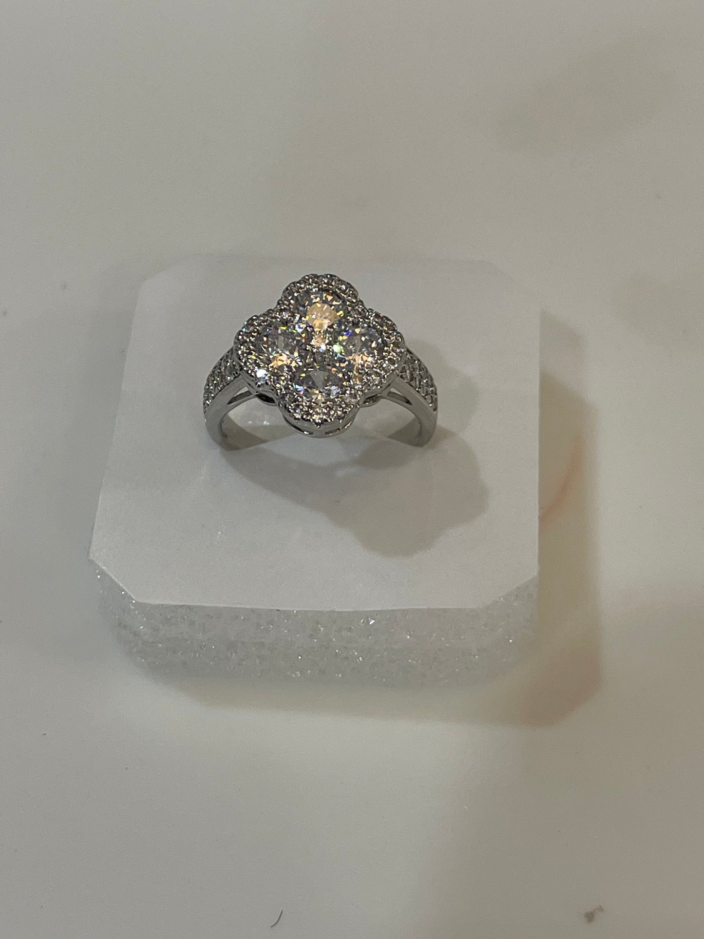 Silver plated ring with multiple gemstones.