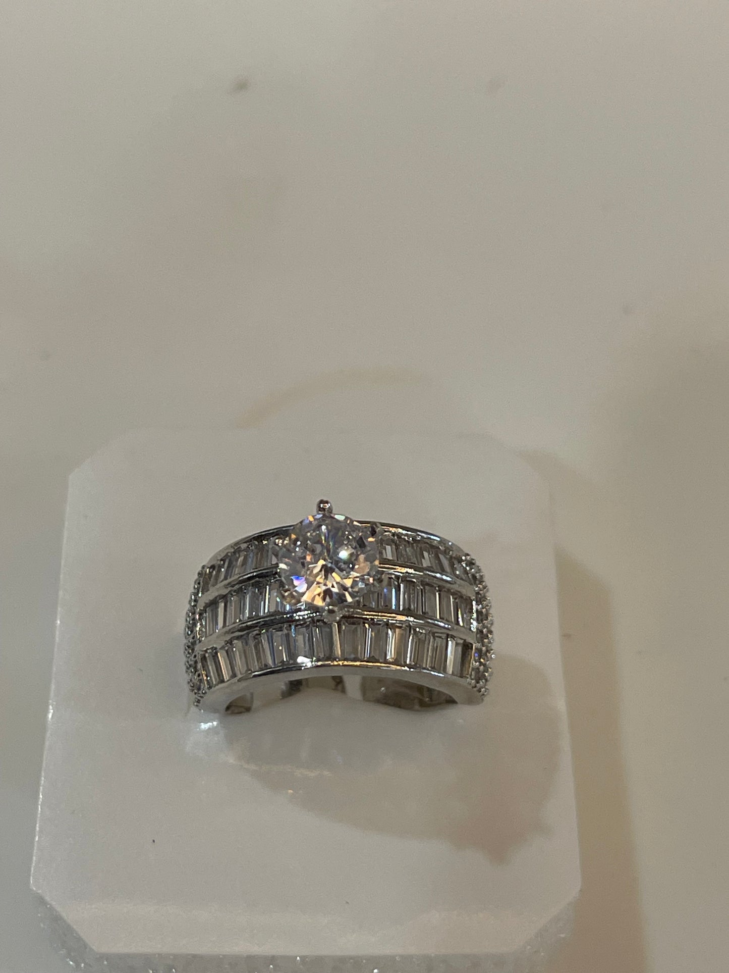 Silver plated ring with Crystals and a gemstone.