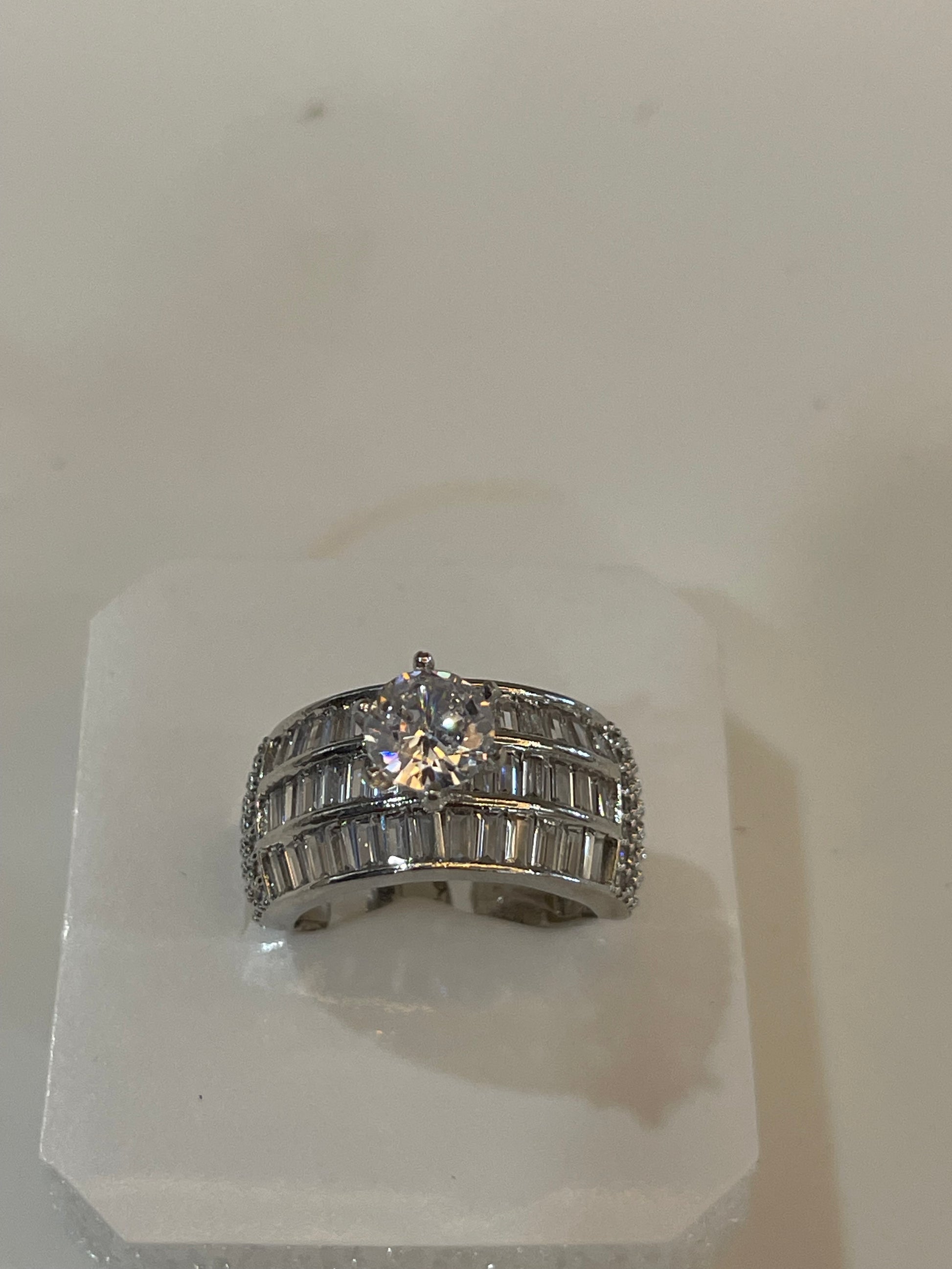 Silver plated ring with Crystals and a gemstone.