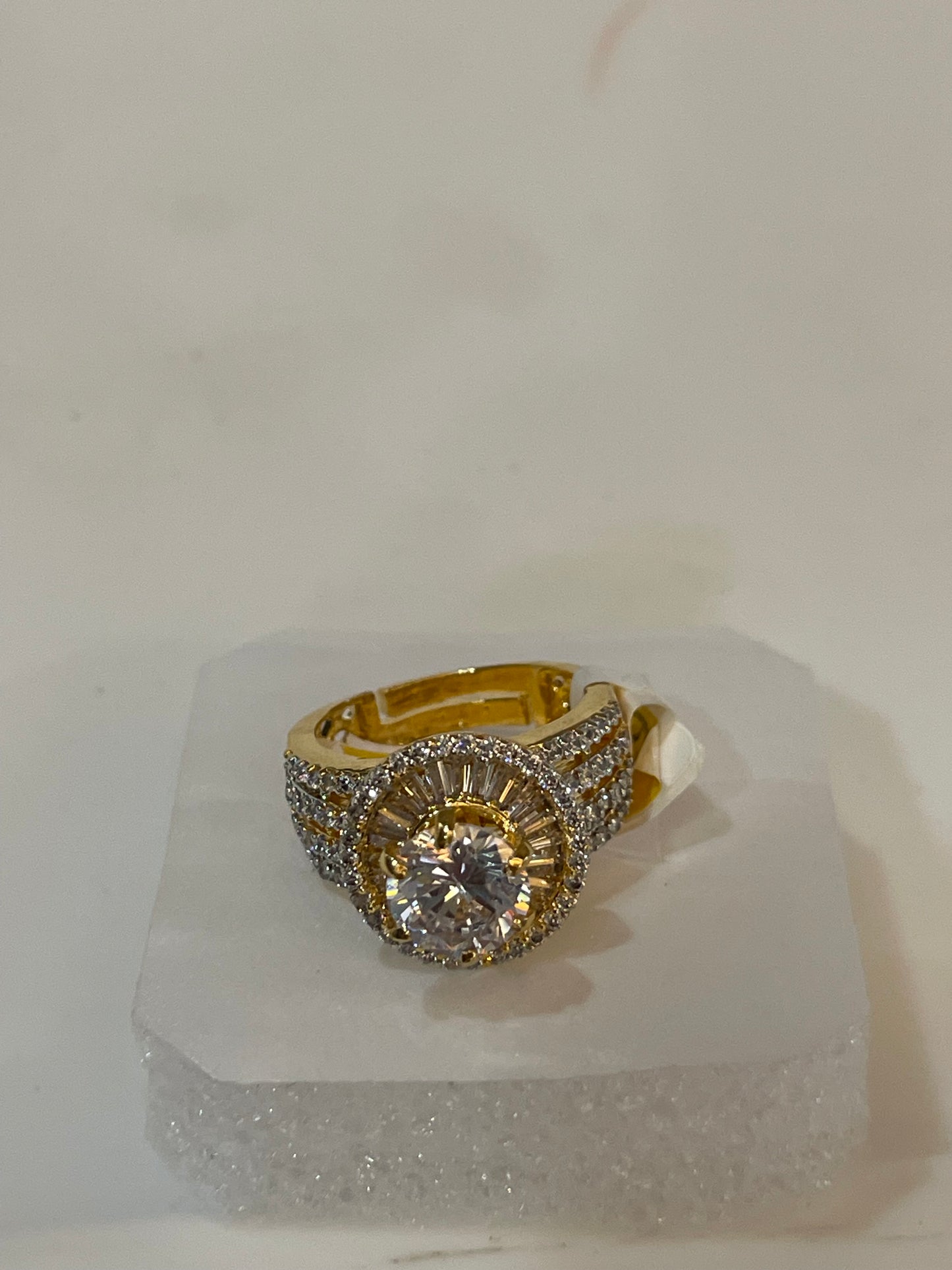 Golden ring with gemstones accents.