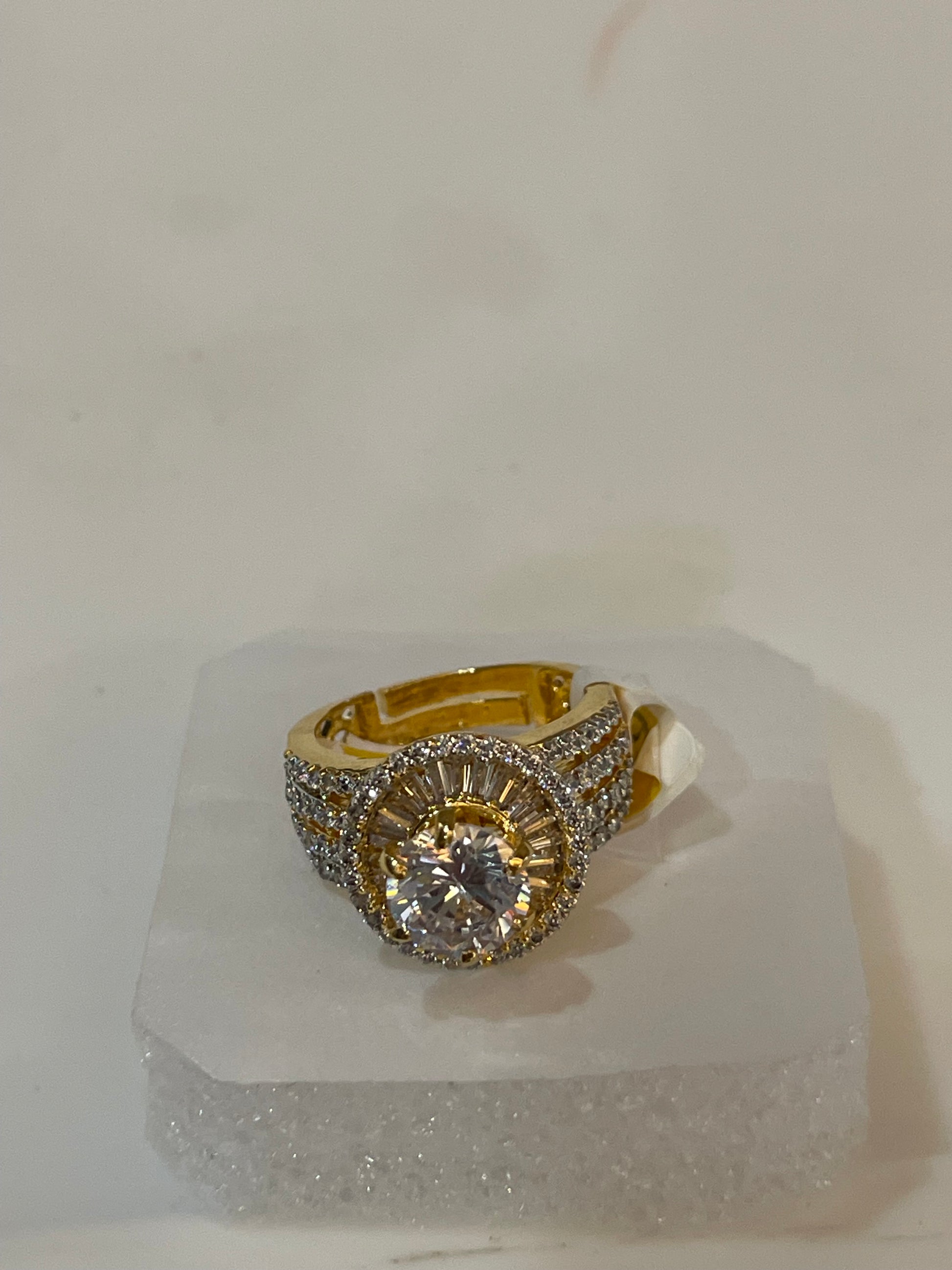 Golden ring with gemstones accents.