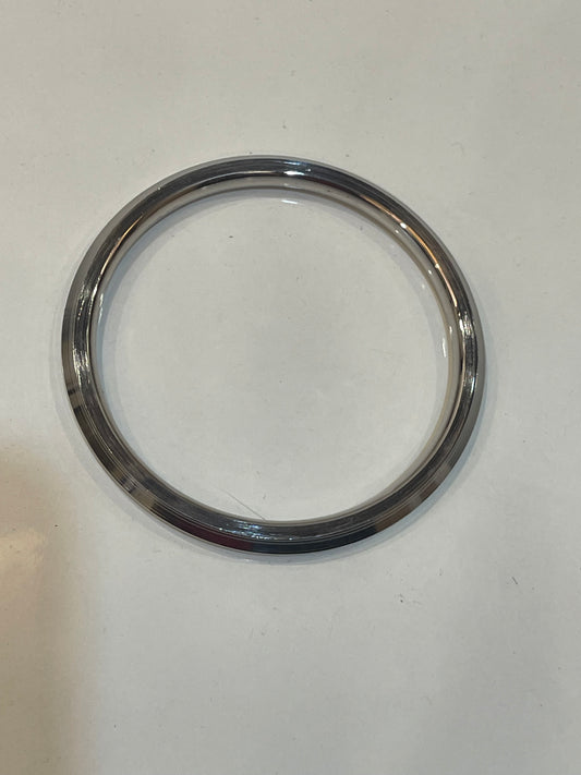 Chrome circular metal ring on a white background