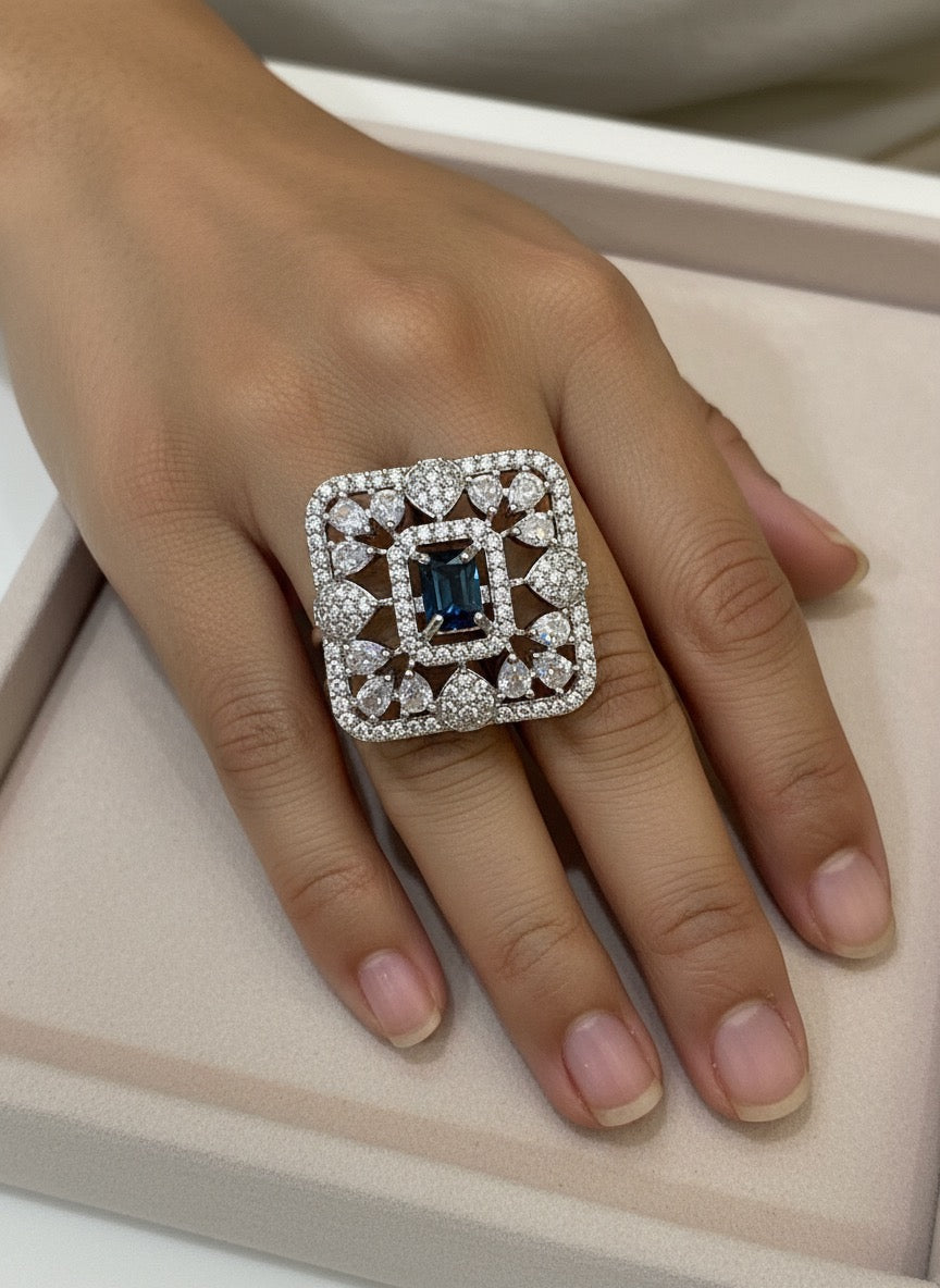 Elegant Sapphire Square ring with a blue gemstone.